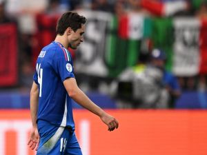 Italy's forward #14 Federico Chiesa reacts at the end of the UEFA Euro 2024 round of 16 football match between Switzerland and Italy at the Olympiastadion Berlin in Berlin on June 29, 2024. (Photo by Kirill KUDRYAVTSEV / AFP) Italy's forward #14 Federico Chiesa reacts at the end of the UEFA Euro 2024 round of 16 football match between Switzerland and Italy at the Olympiastadion Berlin in Berlin on June 29, 2024. (Photo by Kirill KUDRYAVTSEV / AFP)
