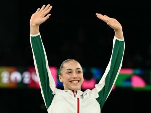 Gold medallist Algeria's Kaylia Nemour poses during the podium ceremony for the artistic gymnastics women's uneven bars event of the Paris 2024 Olympic Games at the Bercy Arena in Paris, on August 4, 2024. (Photo by Lionel BONAVENTURE / AFP) Gold medallist Algeria's Kaylia Nemour poses during the podium ceremony for the artistic gymnastics women's uneven bars event of the Paris 2024 Olympic Games at the Bercy Arena in Paris, on August 4, 2024. (Photo by Lionel BONAVENTURE / AFP)