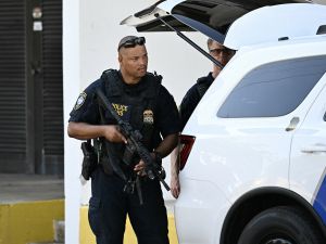 US Department of Homeland Security police officers stand outside the Paul G. Rogers Federal Building and US Courthouse