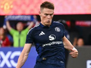 Manchester United's midfielder #39 Scott McTominay scores a penalty kick during the pre-season club friendly football match between Manchester United FC and Arsenal FC at SoFi Stadium in Inglewood, California on July 27, 2024. (Photo by Patrick T. Fallon / AFP)