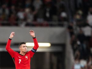 Portugal’s forward #7 Cristiano Ronaldo celebrates victory at the end of the UEFA Nations League football match, group A, between Portugal and Scotlandat Luz stadium in Lisbon on September 8, 2024. Portugal won for 2-1. (Photo by Patricia DE MELO MOREIRA / AFP)