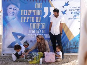 Israeli right-wing activists attend a gathering near the border with Gaza on October 21, 2024, calling to establish a new Jewish settlement in the Gaza Strip.