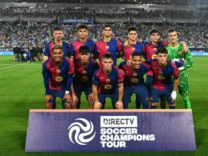 FC Barcelona players pose for a team photo before the start of a 2024 FC Series pre-season friendly football match between FC Barcelona and Manchester City at Camping World Stadium in Orlando, Florida, on July 30, 2024. (Photo by CHANDAN KHANNA / AFP)