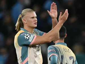 Manchester City's Norwegian striker #09 Erling Haaland applauds fans on the pitch after the UEFA Champions League, league phase football match between Manchester City and Inter Milan at the Etihad stadium, in Manchester, north-west England, on September 18, 2024 The game ended 0-0. (Photo by Paul ELLIS / AFP)