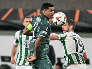 Ferencváros' Hungarian forward #19 Barnabas Varga (R) and Tottenham Hotspur's Argentinian defender #17 Cristian Romero vie for the ball during the UEFA Europa League football match between Ferencvarosi TC and Tottenham Hotspur in Budapest on October 3, 2024. (Photo by Attila KISBENEDEK / AFP)