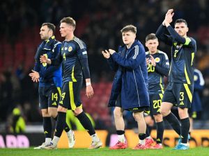 Scotland's defender #03 Andrew Robertson (R) applauds at the end of the UEFA Nations League, League A Group A1 football match between Scotland and Portugal at Hampden Park Stadium in Glasgow, on October 15, 2024. Scotland and Portugal equalised 0 - 0. (Photo by ANDY BUCHANAN / AFP)