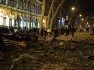 Onlookers gather around a damaged hotel