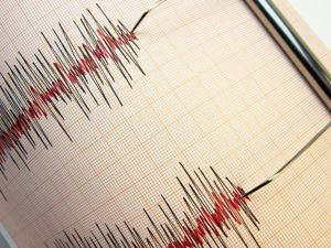 Seismograph and earthquake. A seismograph that records the seismic activity of an earthquake. 