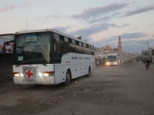 Buses with the International Red Cross emblem on them move towards the eastern Gaza Strip from Khan Yunis in southern Gaza on October 13, 2025, ahead of the release of Israeli hostages held by Hamas since the October 7 attacks two years ago. Photo by OMAR AL-QATTAA / AFP Red Cross