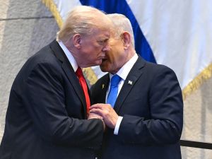 SAUL LOEB / POOL / AFP Photo by SAUL LOEB / POOL / AFP Israeli Prime Minister Benjamin Netanyahu whispers to US President Donald Trump (L) at the Israeli parliament, the Knesset, in Jerusalem on October 13, 2025. Trump's "Pardon Moment" in the Knesset ignites Israeli political firestorm