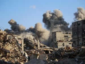 EYAD BABA / AFP // Photo by EYAD BABA / AFP Smoke billows following an Israeli strike that targeted a building in the Bureij camp for Palestinian refugees in the central Gaza Strip on October 19, 2025. Gaza's civil defence agency said a series of Israeli air strikes on October 19 killed at least 11 people across the territory, as Israel and Hamas traded blame for violating a ceasefire. "A war built on lies": Israel fabricates clash to hit Al-Qassam targets under ceasefire
