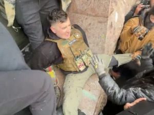 Jake Lang is seen attacked by rioters in Minneapolis