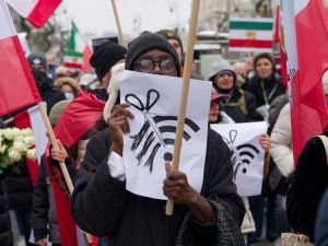 Protestor holds a sign