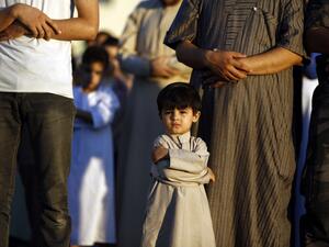 Restricted movement due to the Israeli occupation has made Eid difficult for many Palestinians. (AFP/Mohammed Abed)