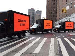 Inspired by the Oscar-nominated film "Three Billboards Outside Ebbing, Missouri", billboards on a truck circle the United Nations on Feb. 22, 2018 for three hours to demand action on Syria in advance of a Security Council vote in New York. 
(TIMOTHY A. CLARY / AFP)