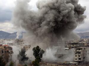 Smoke billows following Syrian government bombardments on Kafr Batna, in the besieged Eastern Ghouta region on the outskirts of the capital Damascus on Feb. 22, 2018. 
(AMER ALMOHIBANY / AFP)