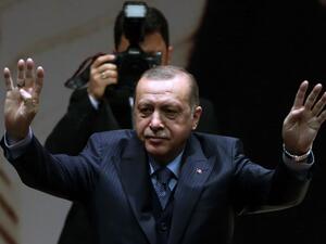 Turkey's President and leader of the Justice and Development Party (AKP) Recep Tayyip Erdogan gestures during the AKP's extended meeting of provincial heads at the party's headquarters in Ankara on Feb. 23, 2018. 
(ADEM ALTAN / AFP)