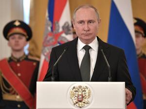 Russian President Vladimir Putin (C) delivers a speech during a ceremony to present national award and to mark the Defender of the Fatherland Day at the Kremlin in Moscow on Feb. 23, 2018. 
(Alexey NIKOLSKY / Sputnik / AFP)