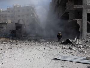A civil Defense volunteer, known as the White Helmets, checks the site of a regime air strike in the rebel-held town of Saqba, in the besieged Eastern Ghouta region on the outskirts of the capital Damascus, on Feb. 23, 2018. Syrian regime air strikes and artillery fire hit the rebel-held enclave of Eastern Ghouta for a sixth straight day killing at least 32 civilians, as the world struggled to reach a deal to stop the carnage.
(ABDULMONAM EASSA / AFP)