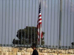 A picture taken on Feb. 24, 2018, shows the U.S. flag flying over the U.S. consulate building complex in Jerusalem, which is considered one of the options to host the new U.S. embassy headquarters after its relocation from Tel Aviv. The United States will move its embassy from Tel Aviv to Jerusalem in May 2018 to coincide with Israel's 70th Independence Day according to U.S. officials.
(AHMAD GHARABLI / AFP)