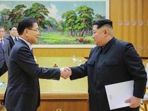 North Korean leader Kim Jong Un shaking hands with South Korean chief delegator Chung Eui-yong (AFP/File Photo)