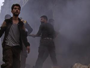 Members of the Syrian civil defense search for survivors in the aftermath of an air strike in the rebel-held town of Harem in the northwestern Idlib province on Mar. 22, 2018. 
(Aaref WATAD / AFP)