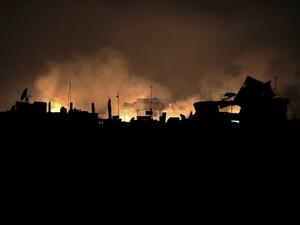 A picture taken early on Mar. 23, 2018 shows flames erupting following regime bombardment in Douma, one of the few remaining rebel-held pockets in Eastern Ghouta on the outskirts of the capital Damascus. 
(HAMZA AL-AJWEH / AFP)