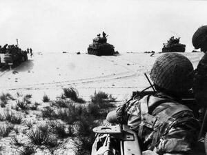 Israeli armored forces in action in this photo taken in June 1967 in the Sinai Desert. Thirty years after the six-day war, new revelations show that Israeli generals exerted considerable pressure to push their government to go into battle. According to military historian Ami Gluska of the Hebrew University in Jerusalem, "a gap separated government officials from soldiers who were on average more than 20 years younger and who were burning to go to war". (STF / AFP) Israeli armored forces in action in this photo taken in June 1967 in the Sinai Desert. Thirty years after the six-day war, new revelations show that Israeli generals exerted considerable pressure to push their government to go into battle. According to military historian Ami Gluska of the Hebrew University in Jerusalem, "a gap separated government officials from soldiers who were on average more than 20 years younger and who were burning to go to war". (STF / AFP)