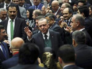 Turkish President Recep Tayyip Erdogan (C) greets the crowd during Turkey's ruling Justice and Development (AK) Party’s provincial chairmen meeting at the party headquarters in Ankara on Mar. 30, 2018. 
(ADEM ALTAN / AFP)