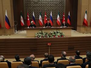 (LtoR) Iran's President Hassan Rouhani, Turkey's President Recep Tayyip Erdogan and Russia's President Vladimir Putin hold a joint press conference during a tripartite summit on Syria, in Ankara, on Apr. 4, 2018. The presidents of Iran, Turkey and Russia met on Apr. 4, 2018 for their second tripartite summit in under six months, aiming to speed the peace process for Syria and bolster their influence in the country.
(ADEM ALTAN / AFP)