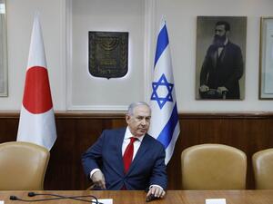 Israeli Prime Minister Benjamin Netanyahu sits in conference room before flags of Japan (L), Israel (C), and a portrait of Theodor Herzl (seen as "Visionary of the Jewish State" and founder of modern Zionism) at the PM office ahead of his meeting with his Japanese counterpart in Jerusalem on May 2, 2018. 
(Abir SULTAN / POOL / AFP) Israeli Prime Minister Benjamin Netanyahu sits in conference room before flags of Japan (L), Israel (C), and a portrait of Theodor Herzl (seen as "Visionary of the Jewish State" and founder of modern Zionism) at the PM office ahead of his meeting with his Japanese counterpart in Jerusalem on May 2, 2018. 
(Abir SULTAN / POOL / AFP)