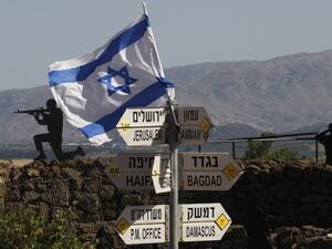 An Israeli flag is seen placed on Mount Bental in the Israeli-annexed Golan Heights on May 10, 2018. Israel's army said today it had carried out widespread raids against Iranian targets in Syria overnight after rocket fire towards its forces it blamed on Iran, marking a sharp escalation between the two enemies. Israel carried out the raids after it said around 20 rockets, either Fajr or Grad type, were fired from Syria at its forces in the occupied Golan Heights at around midnight.
(JALAA MAREY / AFP)