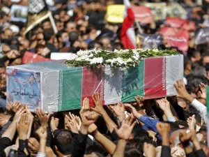 Thousands of people gather in the south-western Iranian city of Ahvaz for the funeral of those killed during an attack on a military parade (AFP)