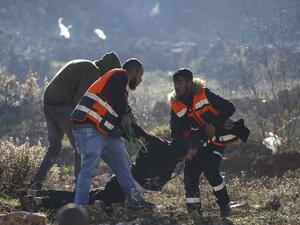 Palestinian medics evacuate a wounded Palestinian protester during clashes between Israeli troops and Palestinian demonstrators in Ramallah. (AFP)