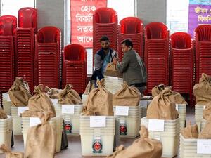 Bangladeshi electoral officials carry polling materials at distributing center in Dhaka on December 29, 2018. (AFP/File)