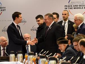 White House US Senior Advisor Jared Kushner (L) shakes hands with US Secretary of State Mike Pompeo as they arrive for a session at the conference on Peace and Security in the Middle east in Warsaw, on February 14, 2019. 
Janek SKARZYNSKI / AFP