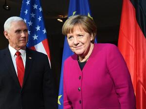 German Chancellor Angela Merkel (R) and US Vice President Mike Pence pose during a photo call at the 55th Munich Security Conference in Munich, southern Germany, on February 16, 2019. The 2019 edition of the Munich Security Conference (MSC) takes place from February 15 to 17, 2019. 
Christof STACHE / AFP