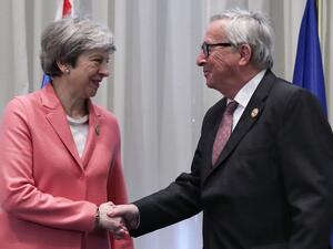Britain's Prime Minister Theresa May (L) greets the European Commission President Jean-Claude Juncker during a meeting on the sidelines of the the first joint European Union and Arab League summit. (AFP/ File)