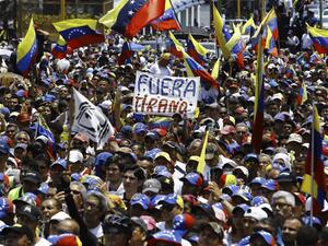 Supporters listen to Venezuelan opposition leader and self-proclaimed interim president Juan Guaido during a rally in Valencia, Carabobo State, Venezuela, on March 16, 2019. (AFP)