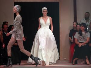 Models present creations by Christian Dior during the Haute Couture Spring-Summer 2019 collection fashion show in the emirate of Dubai on March 18, 2019. 
Karim Sahib / AFP
