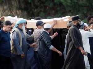 Mourners proceed with the coffin of a shooting victim, slain by an Australian white supremacist gunman who went on a killing spree at two mosques, at the Memorial Park cemetery in Christchurch. (AFP/ File)