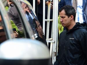 Venezuelan opposition leader and self-proclaimed interim president Juan Guaido leaves the residence of his Chief of Staff Roberto Marrero, who was arrested during a raid early March 21, 2019. (AFP)