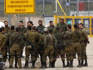 Israeli soldiers stand guard at the Quneitra border crossing of the Israeli annexed-Golan Heights, on March 23, 2019. (AFP/ File Photo)