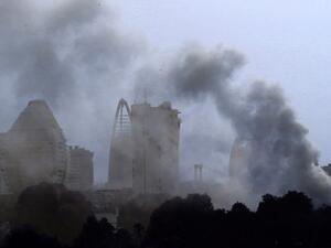 plumes of smoke billow into the sky more than an hour after a fire ripped through Sudan's old presidential palace in the capital Khartoum, on March 23, 2019. (AFP/File)