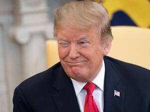 US President Donald Trump winks during a meeting with Israeli Prime Minister Benjamin Netanyahu in the Oval Office at the White House in Washington, DC, March 25, 2019. (SAUL LOEB / AFP)