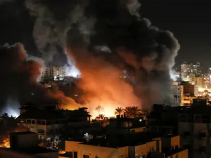 Fire and smoke billow above buildings in Gaza City during reported Israeli strikes on March 25, 2019. Israel's military launched strikes on Hamas targets in the Gaza Strip today, the army and witnesses said, hours after a rocket from the Palestinian enclave hit a house and wounded seven Israelis.
Mahmud Hams / AFP