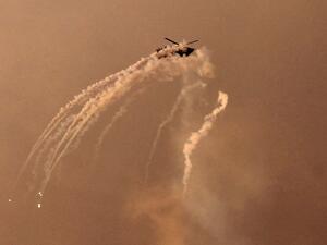 An Israeli helicopter shoots flares over the Gaza Strip (AFP)
