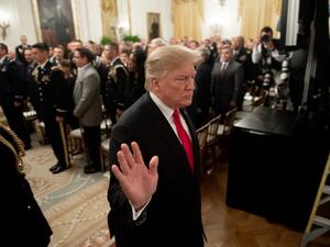 US President Donald Trump leaves after awarding a posthumous Medal of Honor for US Army Staff Sergeant Travis Atkins during a ceremony in the East Room of the White House in Washington, DC. (AFP)