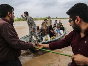 ranian soldiers help civilians in a flooded area in a village around the city of Ahvaz, in Iran's Khuzestan province (AFP)