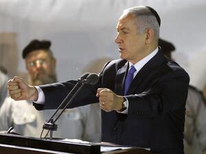 Prime Minister Benjamin Netanyahu (R) attends the funeral of Sergeant First Class Zachary Baumel at the Mount Herzl military cemetery in Jerusalem on April 4 2019. (MENAHEM KAHANA / AFP)